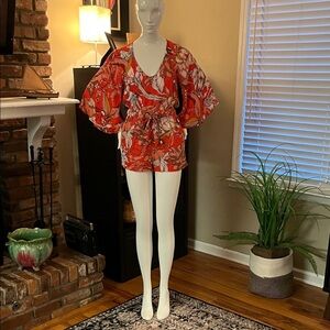 MINKPINK Burnt orange and White Floral Jumpsuit
Size: XS